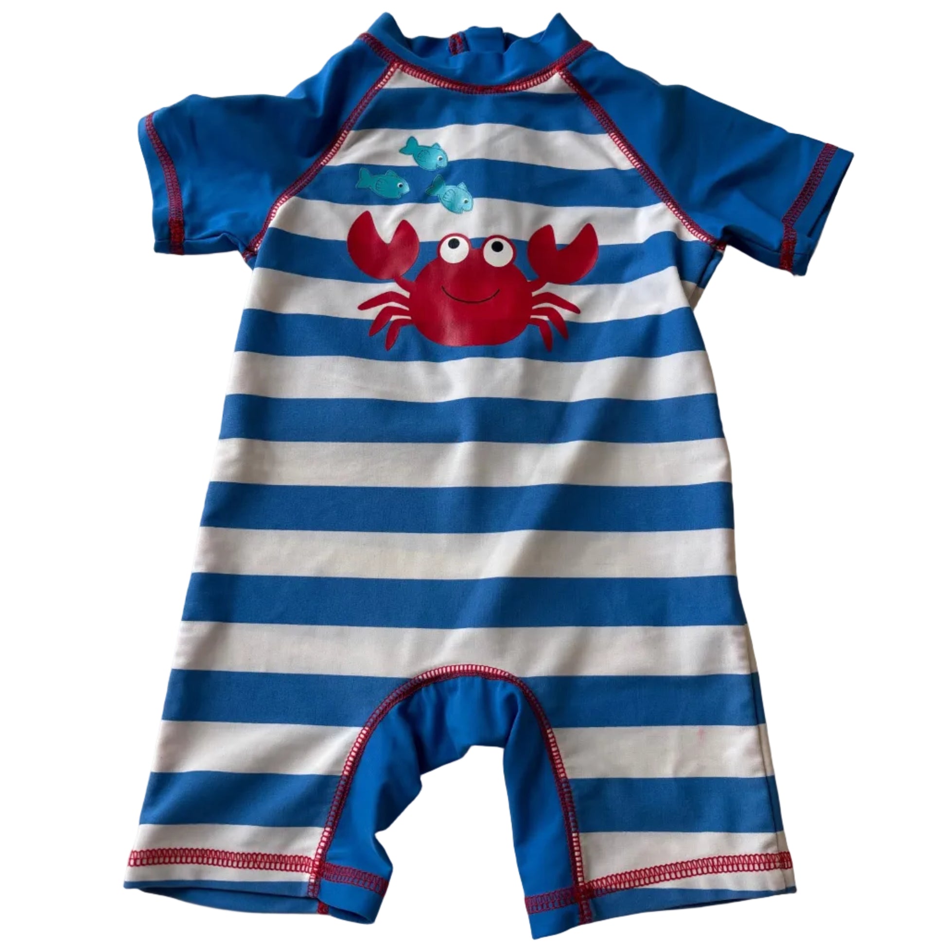 Children's swimsuit with blue and white stripes and a red crab design on a white background