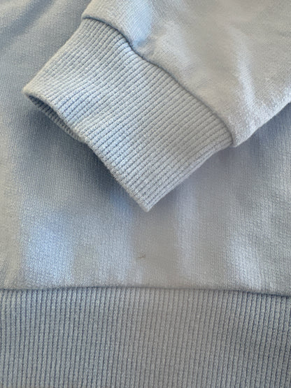 close up of sweatshirt to show small mark on sweatshirt