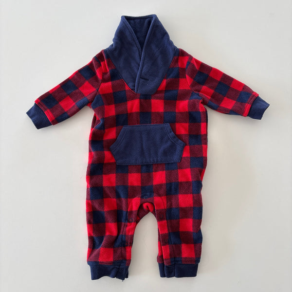 A baby's long-sleeve footless one-piece jumpsuit featuring a red and navy buffalo plaid pattern with solid navy blue trim on the collar, cuffs, and pockets, laid flat on a light gray background.