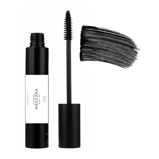 Black mascara with wand and sample on a white background