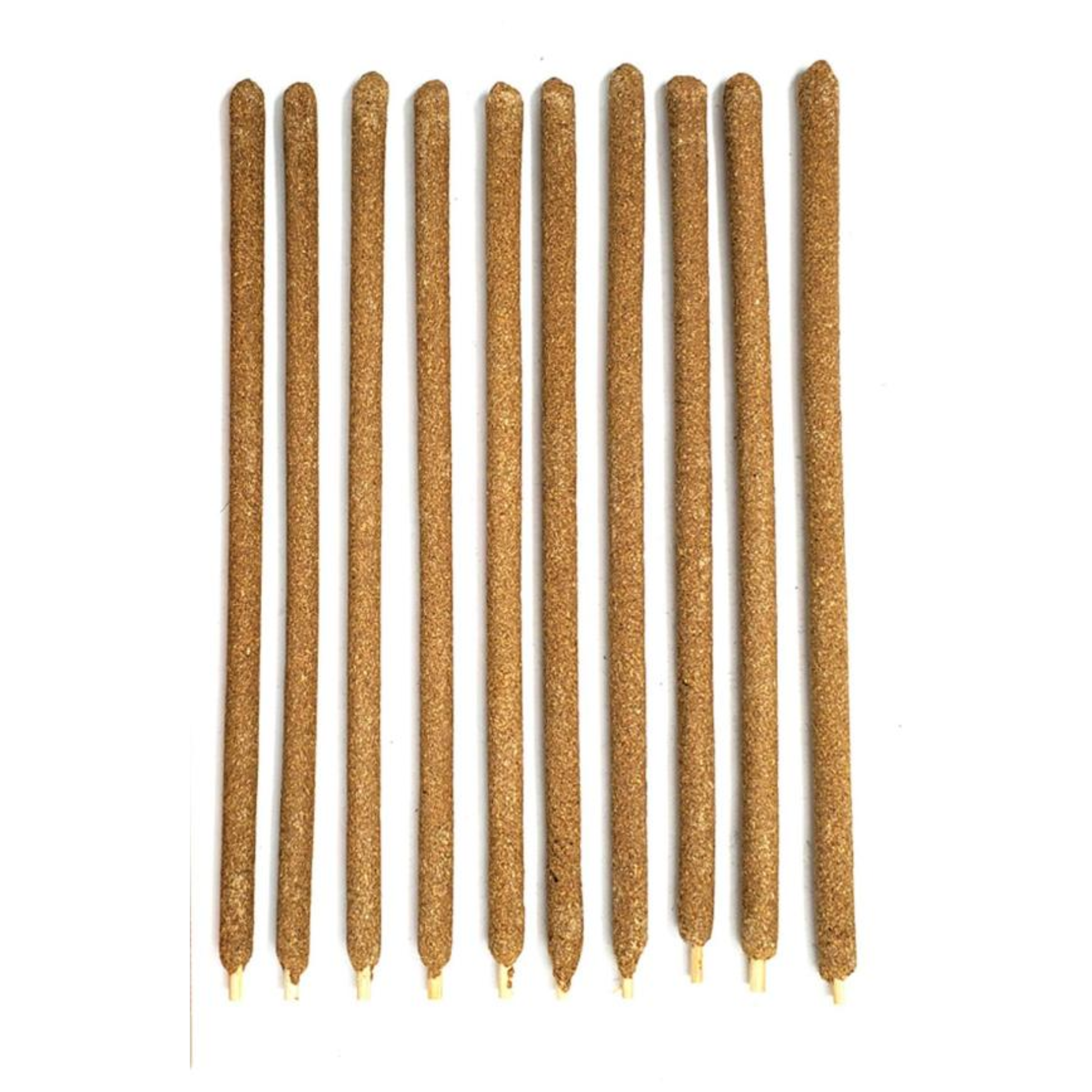 Row of brown incense sticks on a white background