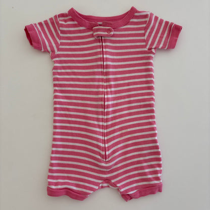 Pink and white striped baby romper on a light gray background