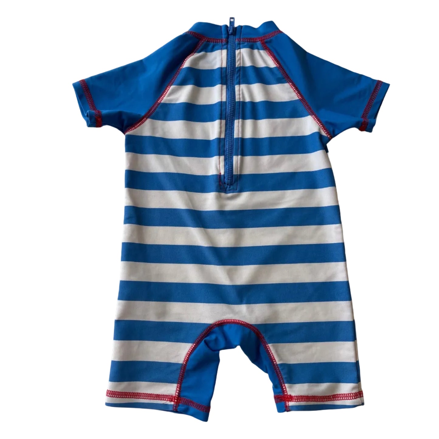 Blue and white striped swimsuit on a white surface