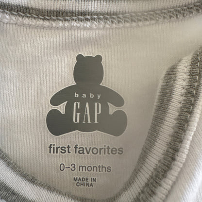 Baby Gap label on a product with 'first favorites' and size information.