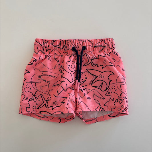 swim trunks with pictures of sharks printed on them
