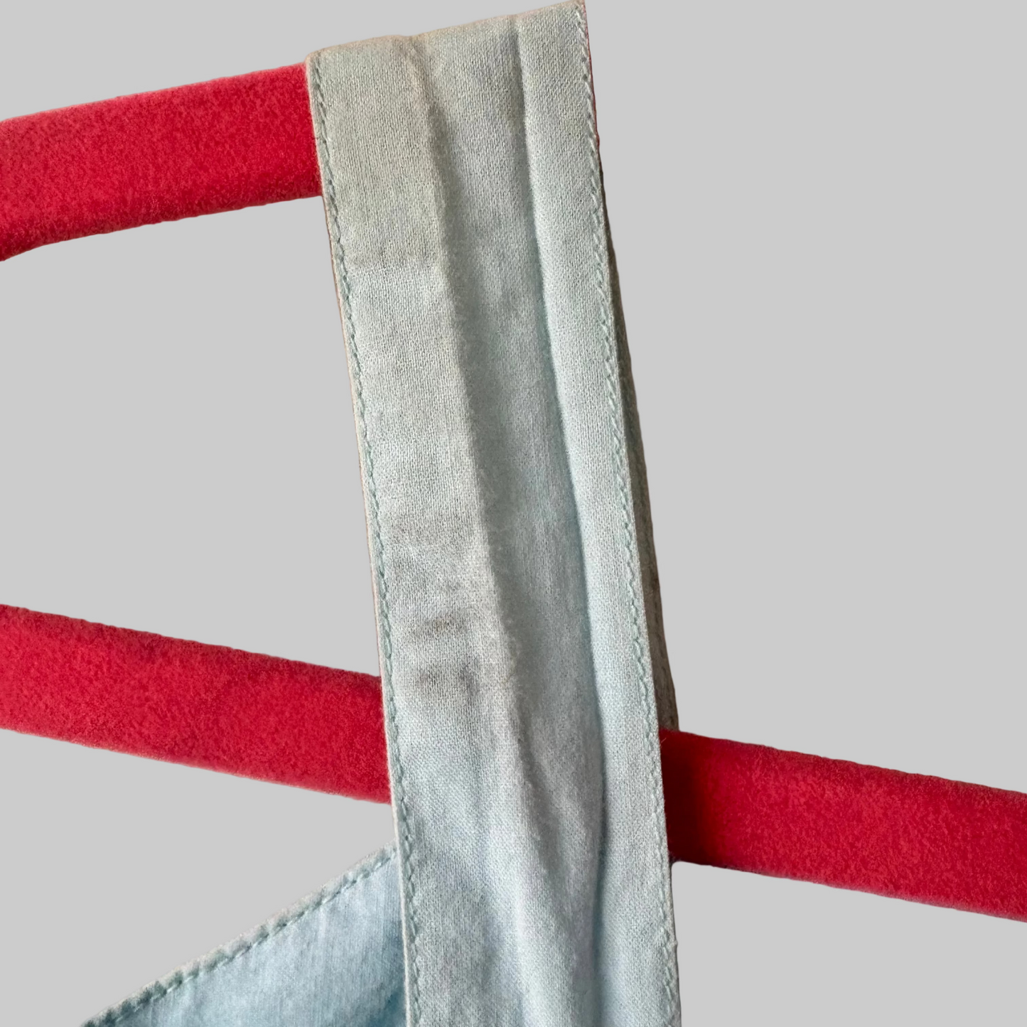 Shows strap of dress and light smudging on the strap